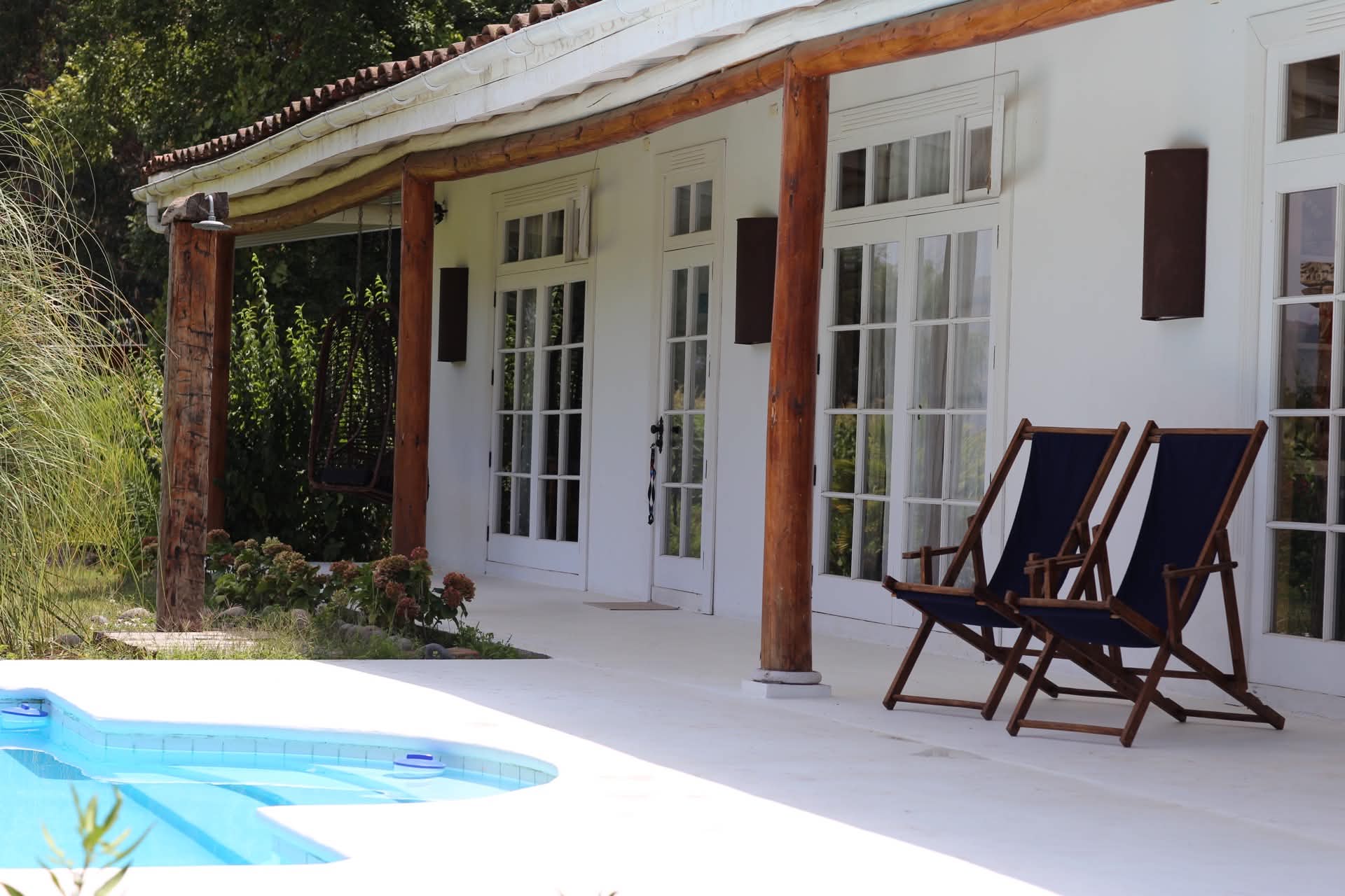 The swimming pool and surrounding garden.