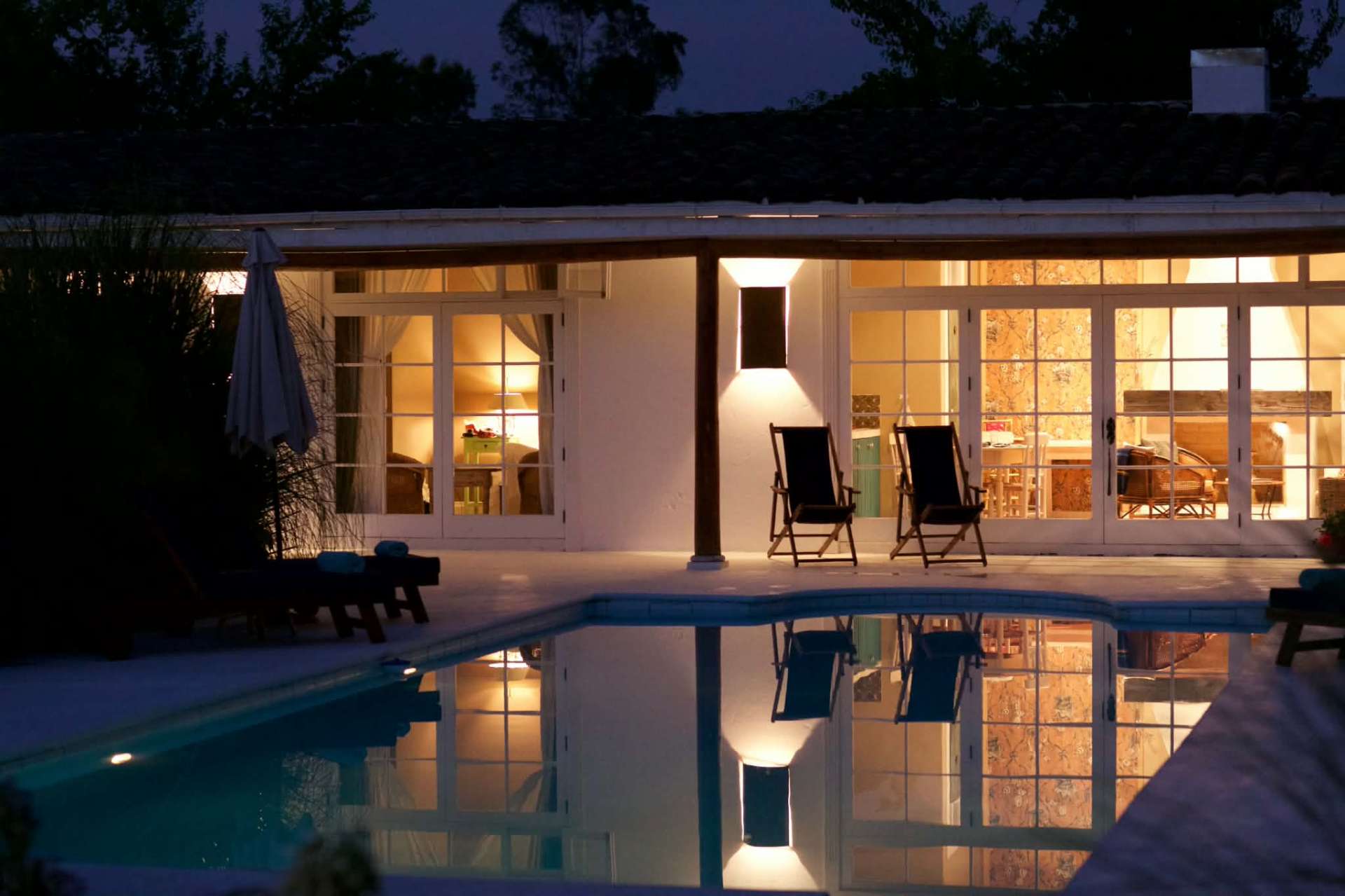 The swimming pool and surrounding garden.